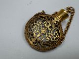 an image of a gold pocket watch with a chain around it