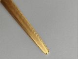 a wooden toothbrush that is laying on a table