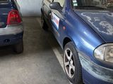 two cars that are parked in a parking garage