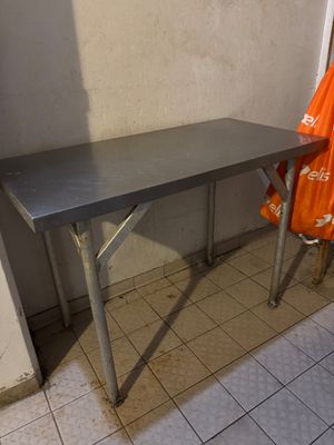 a table with a towel hanging on it in a room