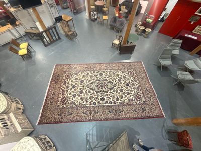 a large rug on the floor in the middle of a room
