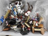 a box full of toy figurines sitting on a table