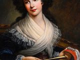 portrait of a woman in a blue dress holding a fan
