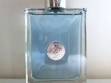 an image of a bottle of perfume on a table