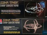 two star trek deep space ships are on display in a box