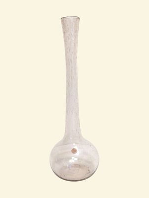 a glass vase that is sitting on a table