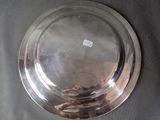 a silver plate that is sitting on a table