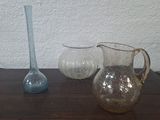 three vases sitting on a table next to each other