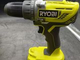a cordless drill that is sitting next to a battery