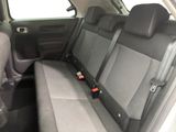 the back seats of a car are empty and the seats are empty