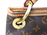 a close up of a purse with a handle on it