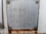 a metal plaque on the side of a building
