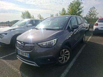 two cars parked in a parking lot next to each other