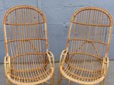 pair of vintage rattan chairs in the style of the early 20th century