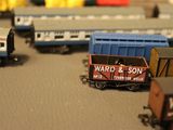 many toy trains that are on the table together