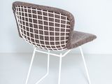 an image of a chair in a room with a white wall