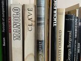 many books that are on a shelf in the room