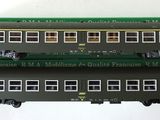 three model trains sitting on top of each other on a table