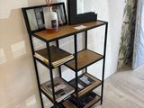 a book shelf with books on it in the corner of a room