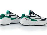 a pair of white and green sneakers on a white surface