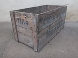 a wooden crate that is sitting on the ground