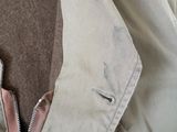 a close up of a jacket with a zipper on it