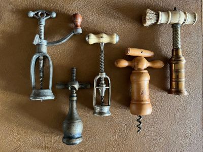 several different types of cork openers on a table