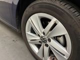 a close up of a car tire on the street