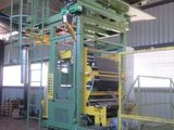 a machine that is working on a piece of paper