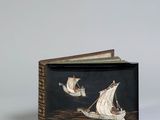 an image of a book with a picture of a boat on it