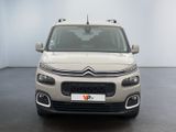 the front of a white citrole parked in a room