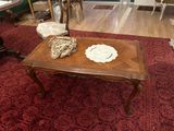 a table with a plate on top of it in a living room