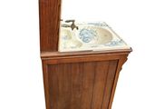 a sink that is sitting on top of a wooden cabinet