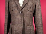 an image of a brown jacket on a mannequin