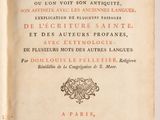 an old book with french writing on it sitting on top of a table
