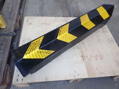 a yellow and black hazard hazard strip on a pallet