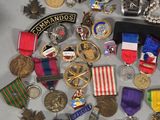 a lot of medals and medals that are on a table