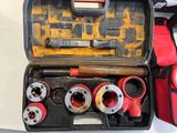 a tool case with tools in it sitting on a table