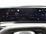 the dashboard of a car with a digital display on it
