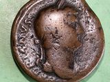 an old coin with a picture of a man on it