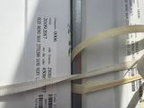 a box tied up with a yellow ribbon on top of it