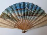 a fan that has a picture of a house on it