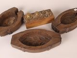 three wooden ashtrays and a wooden box on a white surface