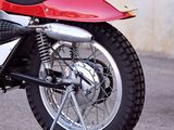 a red and black motorcycle parked in a parking lot