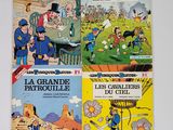 trois livres sur une table blanche sur fond blanc