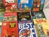 several children ' s books are lined up on a table