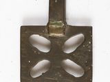 a small metal object that is on a white surface
