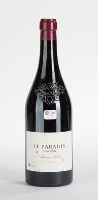 a bottle of wine that is sitting on a table