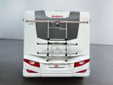 an image of a white bus parked in a room