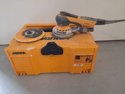 the machine is sitting on top of the box in the room